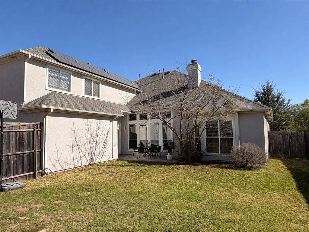 2301 Clearspring Drive S, Irving, TX 75063 Big backyard featuring a manicured lawn and privacy fencing
