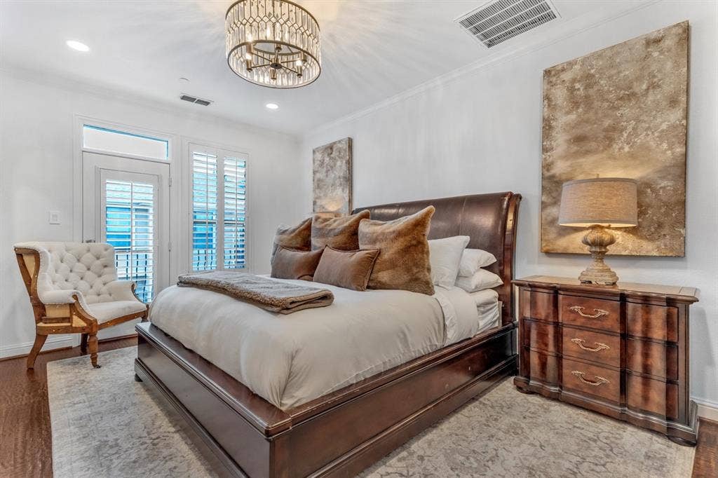 Bedroom featuring dark wood-finish flooring and a decorative area rug