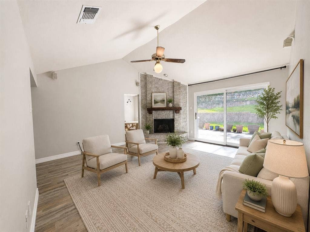 601 Ascot Drive, Euless, TX 76040 Living area featuring a vaulted ceiling and wood-finish flooring