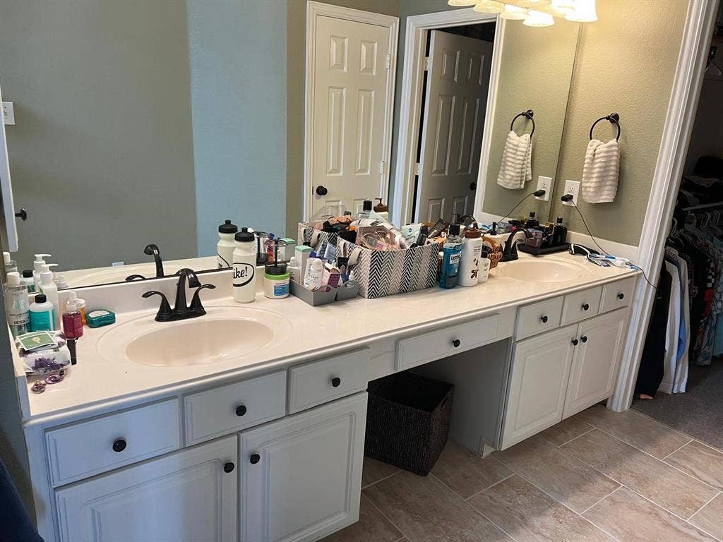 Double vanity featuring integrated sinks and matte black fixtures