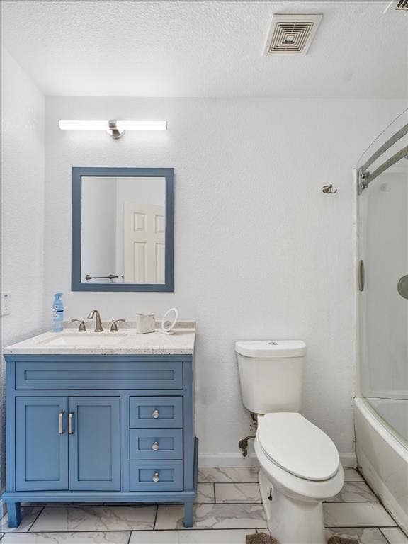 1039 Wood Brook Drive, Grand Prairie, TX 75052 Bathroom featuring a blue vanity with a light-colored countertop, wall-mounted mirror, and contemporary light fixture