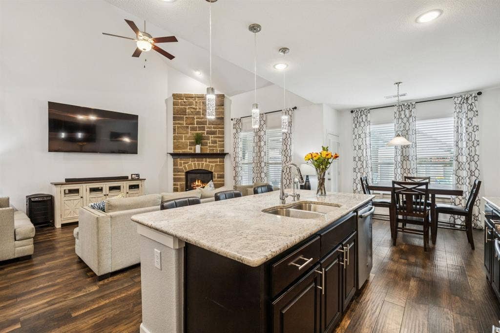 Kitchen is open to the living area, has 2 seating areas and offers a backyard view.