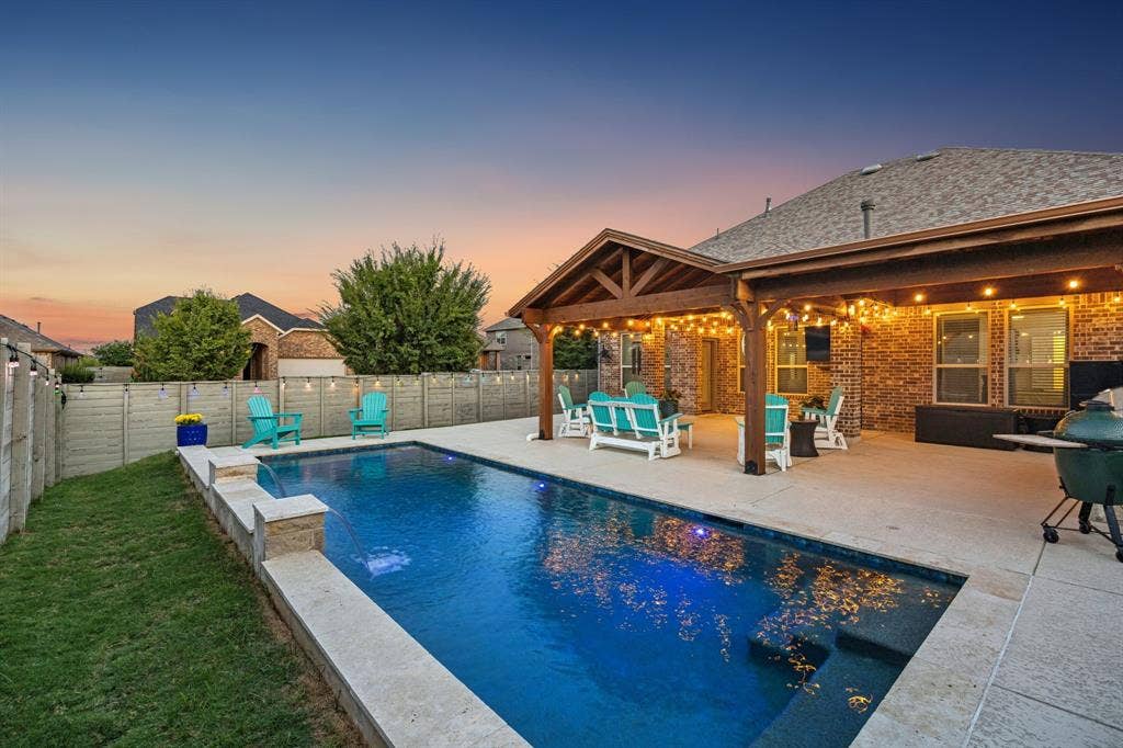 LED lighted pool and lights on the fence and patio provide the perfect ambiance.