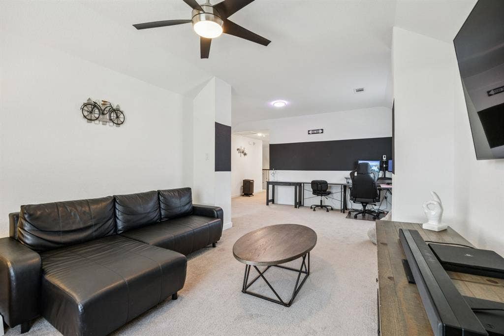 Another view of second floor living area and adjacent game room area.