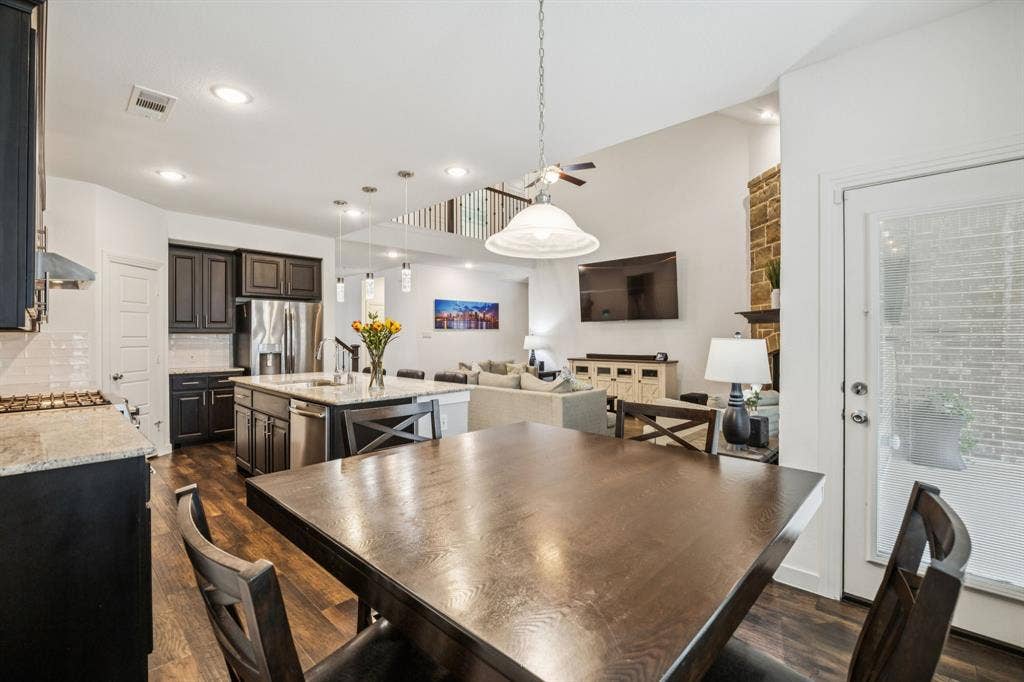 A secondary dining area overlooks the backyard area.