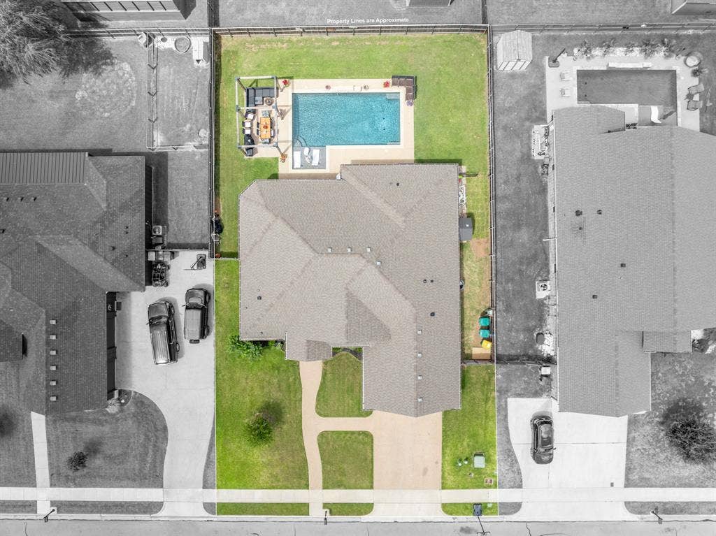 386 Cavitt Court, Robinson, TX 76706 Aerial perspective showcasing a property with a distinct, multi-gabled roofline