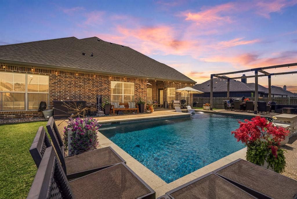 386 Cavitt Court, Robinson, TX 76706 Private backyard oasis featuring a sparkling inground pool with integrated spa