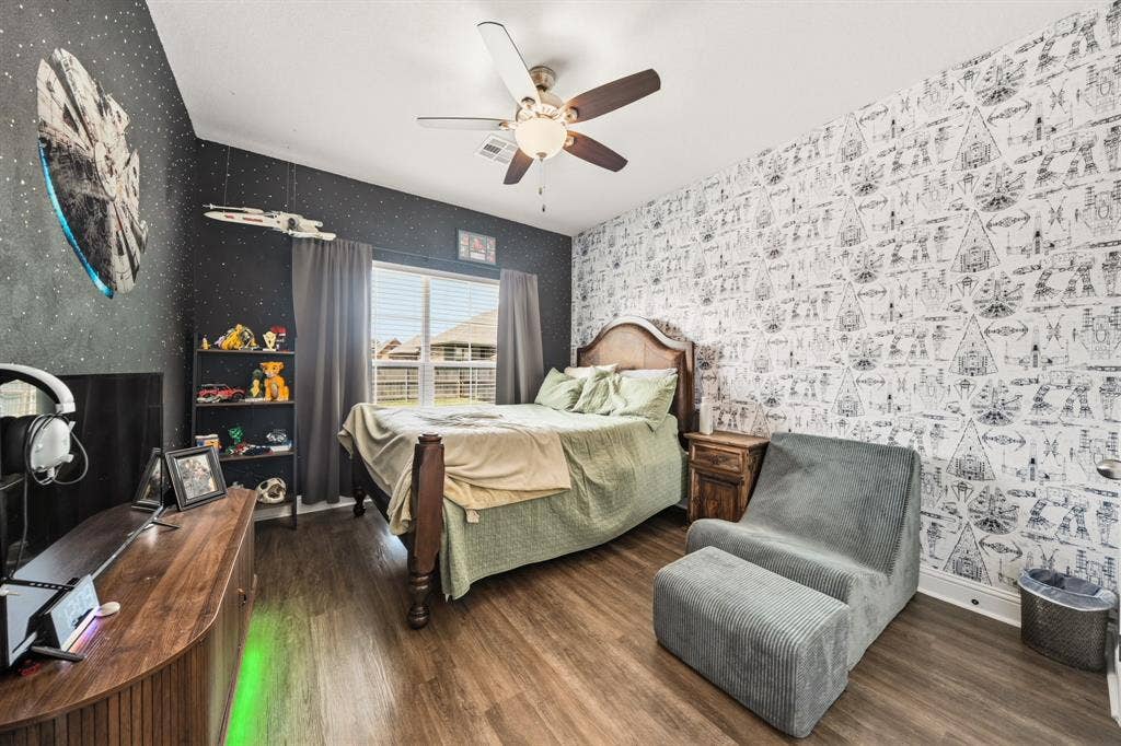 386 Cavitt Court, Robinson, TX 76706 Bedroom featuring wood-finish flooring, a ceiling fan, and a window with blinds
