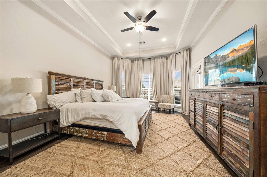 386 Cavitt Court, Robinson, TX 76706 Spacious room with tray ceiling, dark wood-finish flooring, recessed lighting, and a ceiling fan