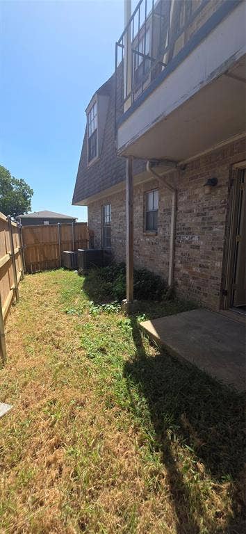 235 Vista Way, Benbrook, TX 76126 Brick exterior with a second-story balcony