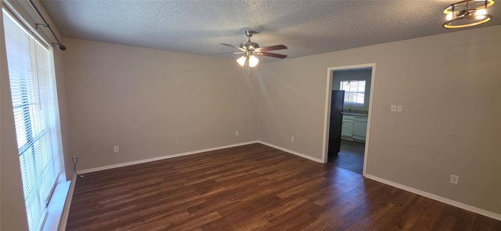 235 Vista Way, Benbrook, TX 76126 Wood-finish flooring, neutral wall paint, and ceiling fan with integrated lighting