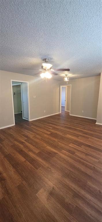 235 Vista Way, Benbrook, TX 76126 Spacious interior featuring wood-finish flooring, neutral wall paint, and ceiling fans with integrated lighting