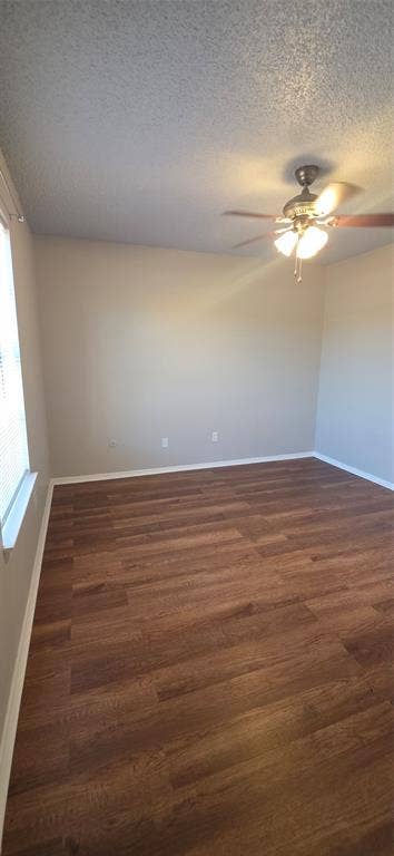 235 Vista Way, Benbrook, TX 76126 Wood-finish flooring, neutral-toned walls, and a ceiling fan with integrated lighting