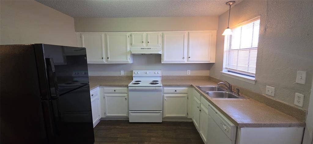 235 Vista Way, Benbrook, TX 76126 Kitchen featuring white cabinetry, light-toned countertops, a stainless steel double sink, white range, and wood-finish flooring