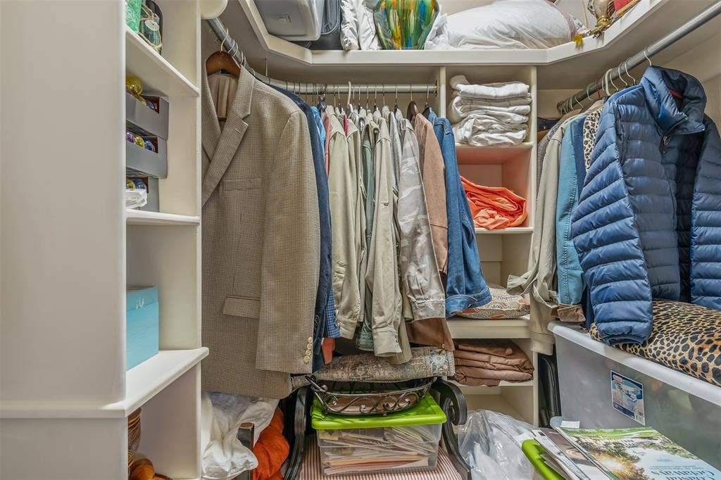 126 E Post Oak, Frankston, TX 75763 Custom closet system featuring multiple hanging rods, integrated shelving, and corner storage