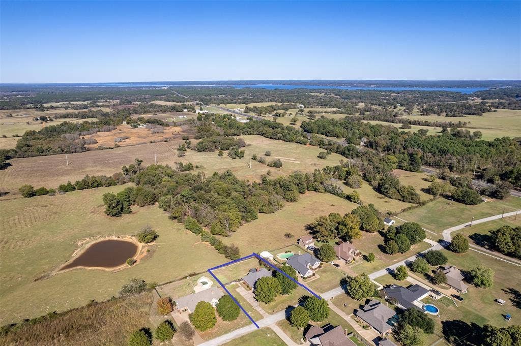 126 E Post Oak, Frankston, TX 75763 Aerial perspective featuring a residential property outlined in blue