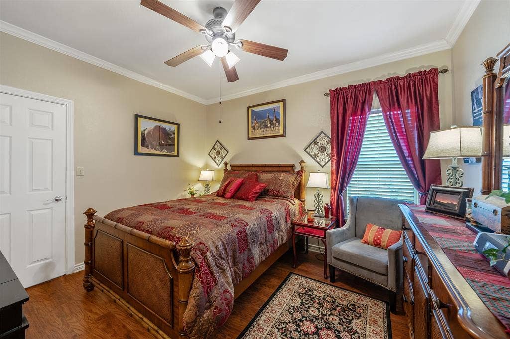 126 E Post Oak, Frankston, TX 75763 Wood-finish flooring with crown molding and a ceiling fan