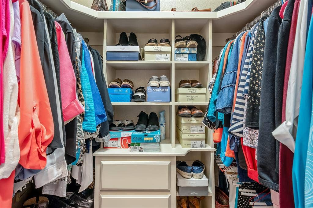 126 E Post Oak, Frankston, TX 75763 Custom closet system featuring built-in shelving, hanging rods, and integrated drawers