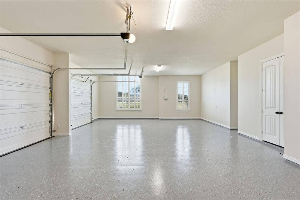 8260 Faithful Drive, Waxahachie, TX 75167 fresh new epoxy floor in attached 3 car garage