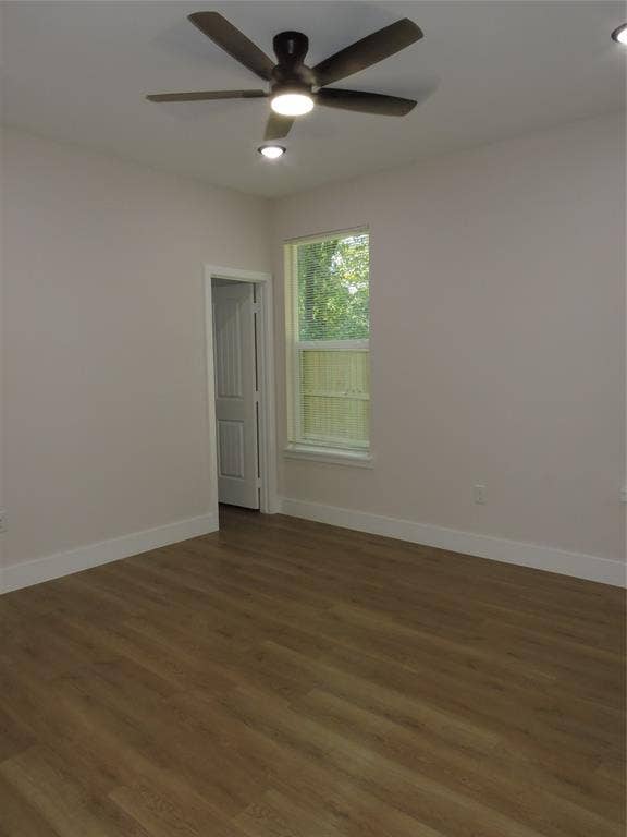 163 Lake Creek Drive, Mabank, TX 75156 Room featuring wood-finish flooring, white baseboards, a window with exterior visibility, recessed ceiling lighting, and a ceiling fan