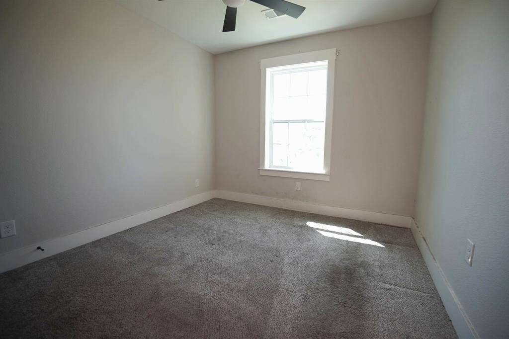 1764 Palladio Loop, Princeton, TX 75407 Carpeted flooring, white trim, window, and ceiling fan