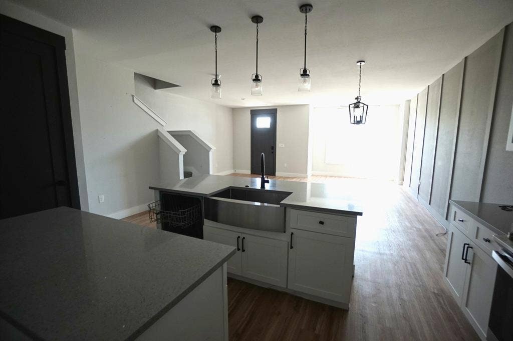 1764 Palladio Loop, Princeton, TX 75407 Kitchen island with quartz countertops, undermount sink, and pendant lighting