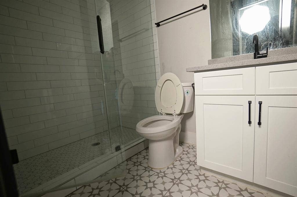 1764 Palladio Loop, Princeton, TX 75407 Walk-in shower with subway tile surround and glass enclosure