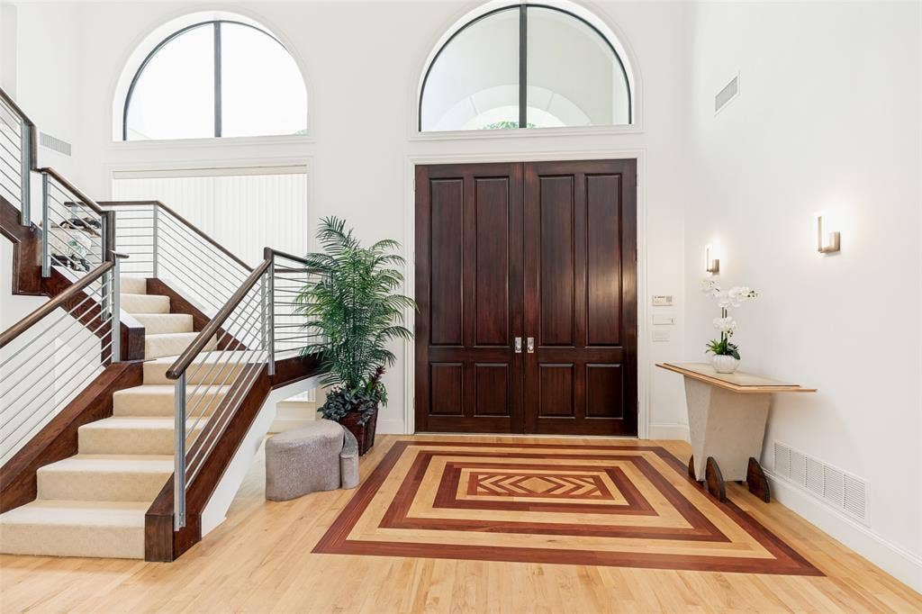 5920 Mcfarland Drive, Plano, TX 75093 Grand entry foyer featuring a striking inlaid wood floor design