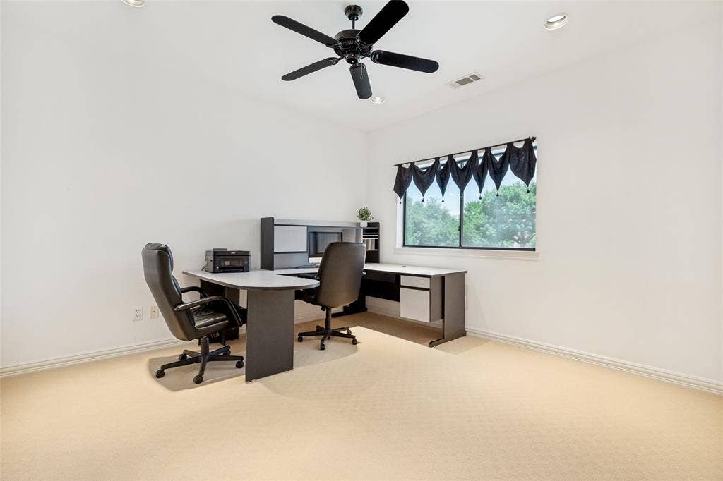 5920 Mcfarland Drive, Plano, TX 75093 Spacious room featuring neutral carpeting, a black ceiling fan with integrated lighting, and recessed ceiling lights