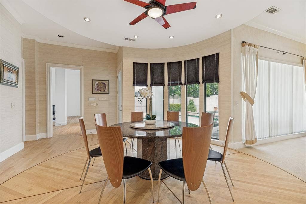 5920 Mcfarland Drive, Plano, TX 75093 Dining area featuring a curved wall of large windows overlooking the exterior