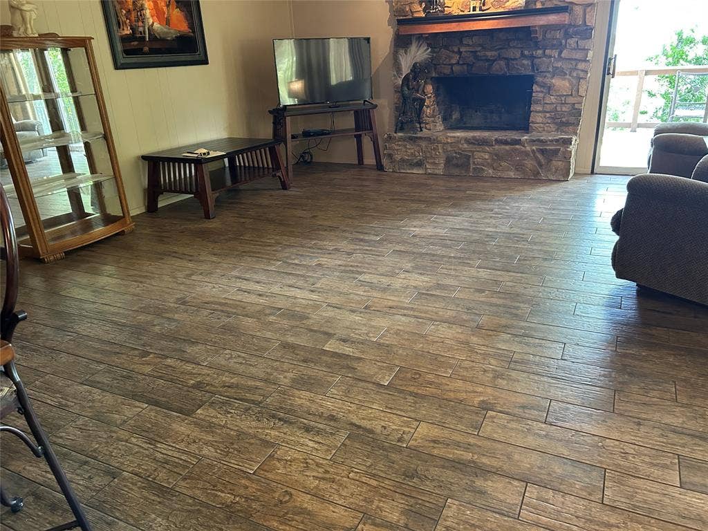 2546 Rockcliff Court, Granbury, TX 76048 wood like tile flooring