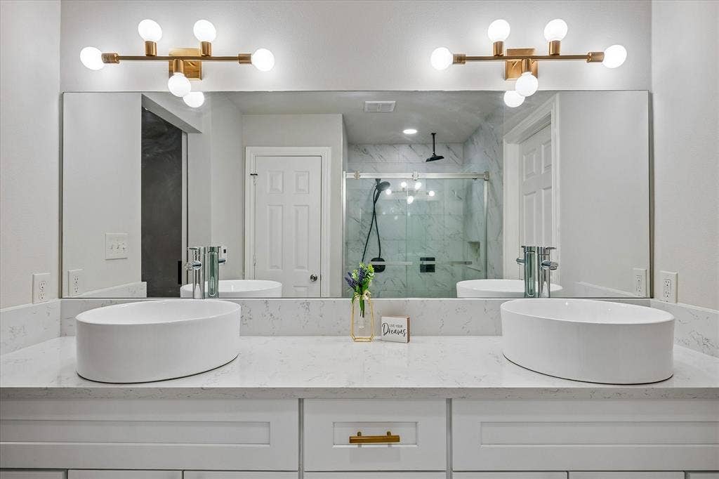 Dual Sinks in the Primary Bath with new cabinets.