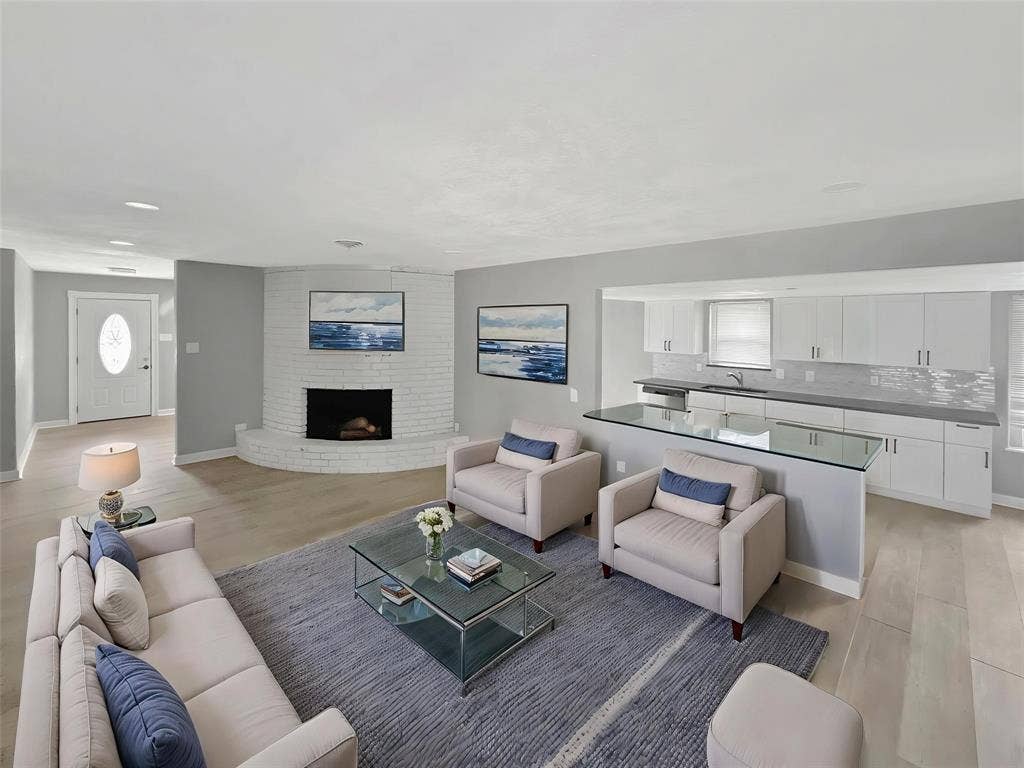 1306 Elby Street, Irving, TX 75061 Virtually staged Open-concept living area featuring light wood-finish flooring