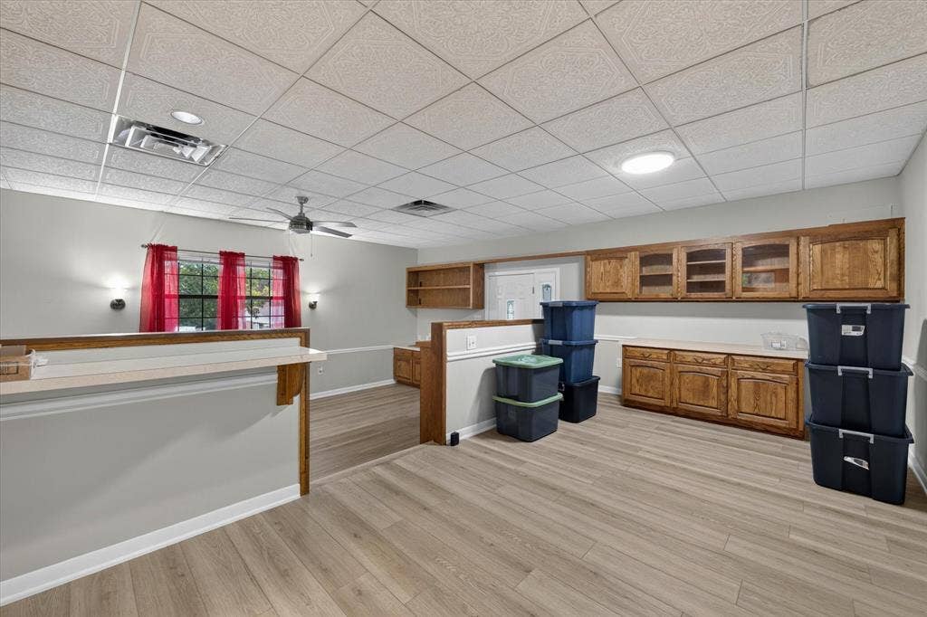 9700 Brookwood Circle, Woodway, TX 76712 Dining area that overlooks den with multiple built in cabinets for storage