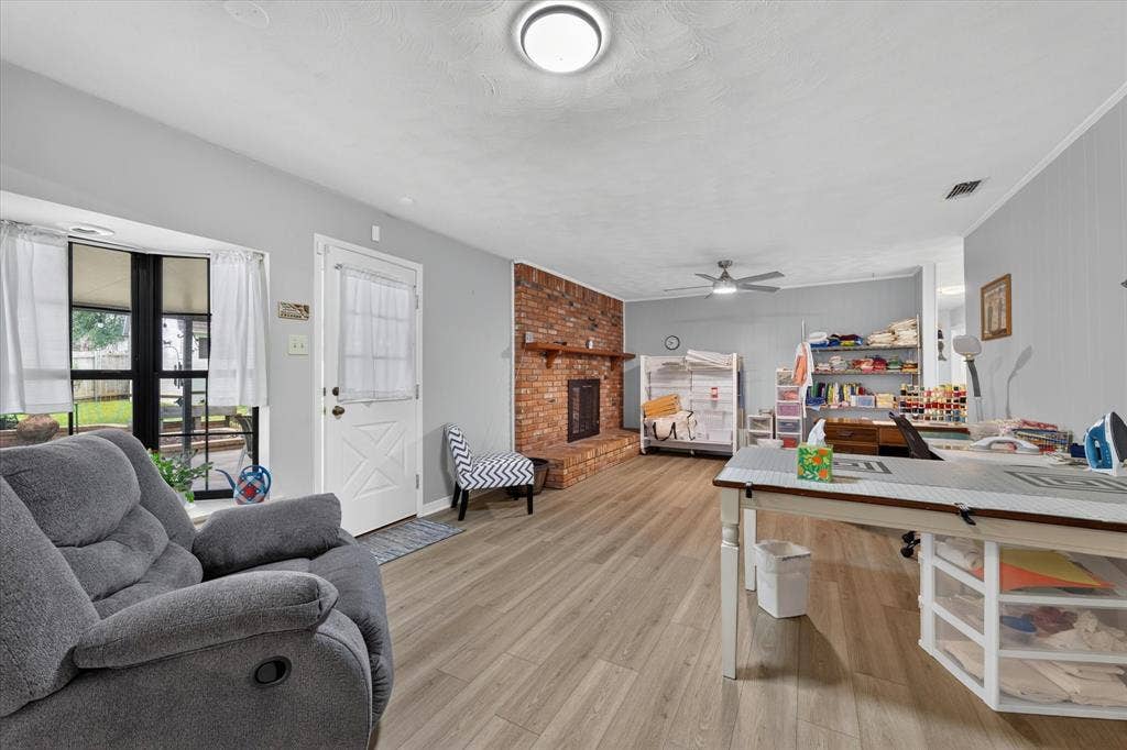 9700 Brookwood Circle, Woodway, TX 76712 Breakfast nook and family room currently used for a craft space