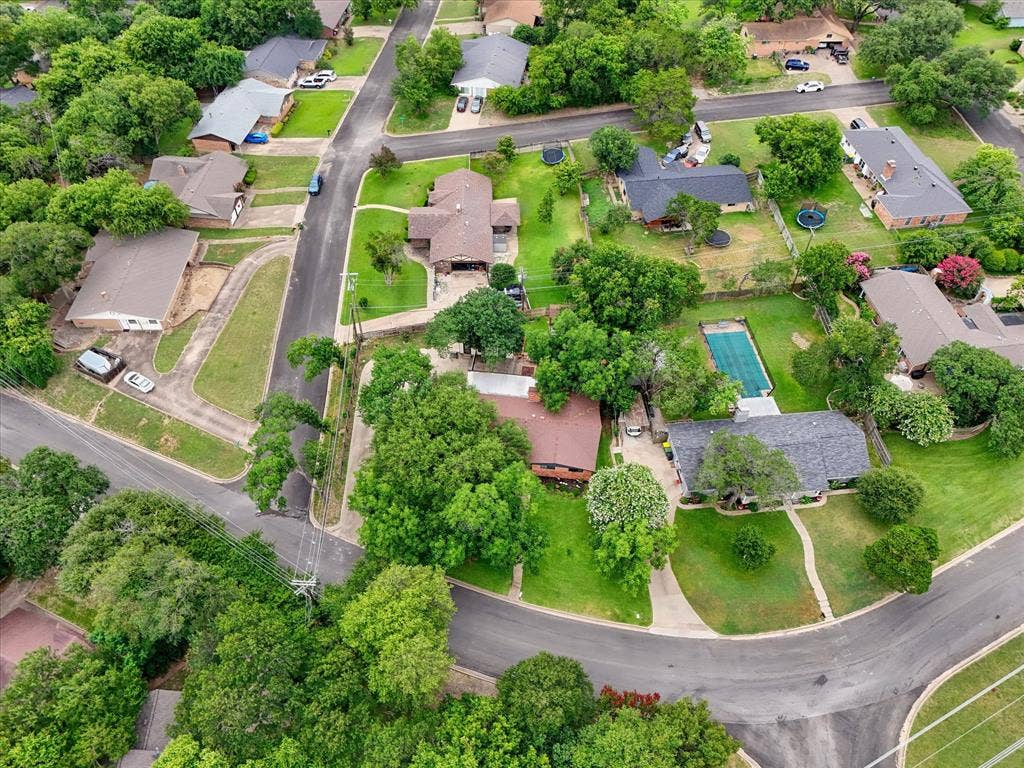 9700 Brookwood Circle, Woodway, TX 76712 Aerial perspective showcasing a residential neighborhood with mature trees