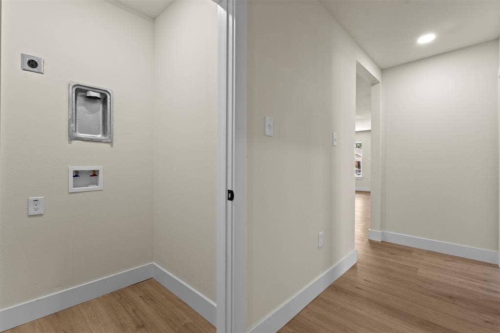 1104 S Brighton Avenue, Dallas, TX 75208 Utility closet with wood-finish flooring, light-toned walls, and recessed lighting