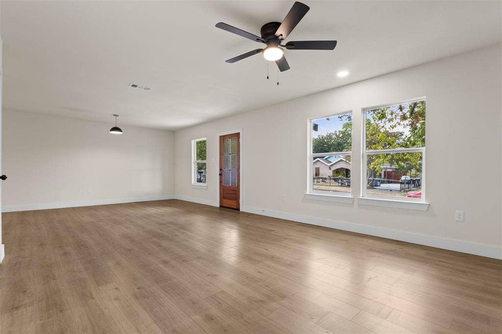 1104 S Brighton Avenue, Dallas, TX 75208 Wood-finish flooring, recessed lighting, and a modern ceiling fan