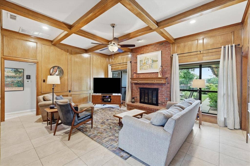 642 Eagle Drive, Coppell, TX 75019 Spacious living area invites you to come in and sit a while. Wood burning fireplace with fireplace screen and gas starter.
