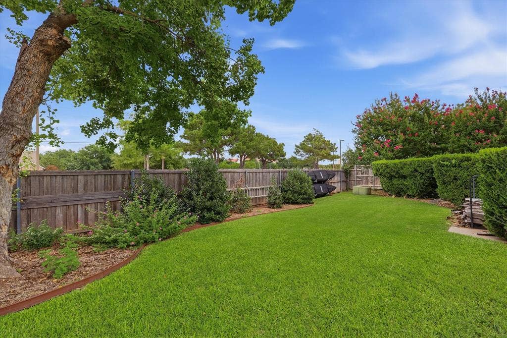642 Eagle Drive, Coppell, TX 75019 A view from the back corner towards the side driveway.
