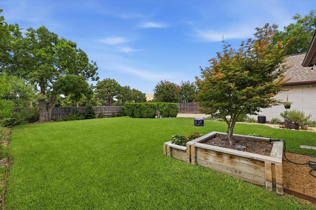 642 Eagle Drive, Coppell, TX 75019 Front corner of the yard looking toward the driveway.