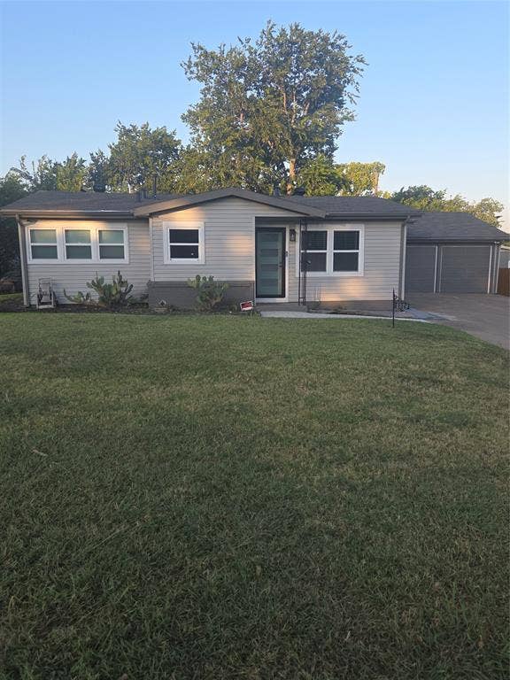 2329 Cass Street, Fort Worth, TX 76112 Single-story residence featuring light-colored siding and a dark roof
