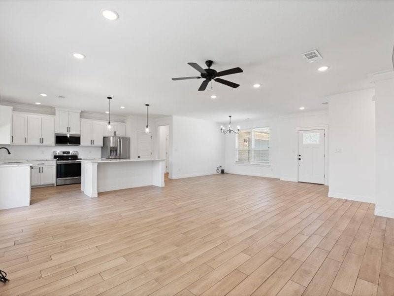 5528 Mesa Loop, Granbury, TX 76048 Open-concept living space featuring wood-finish flooring