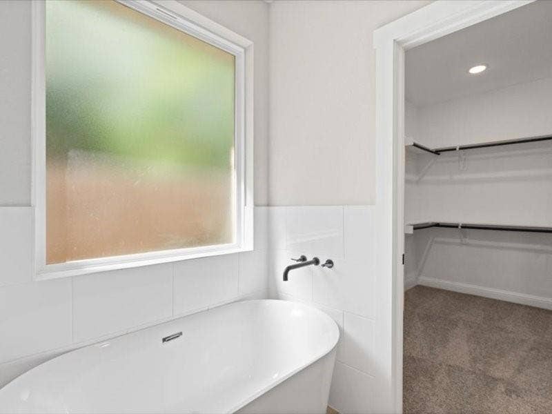 5528 Mesa Loop, Granbury, TX 76048 Freestanding soaking tub with matte black wall-mounted fixtures