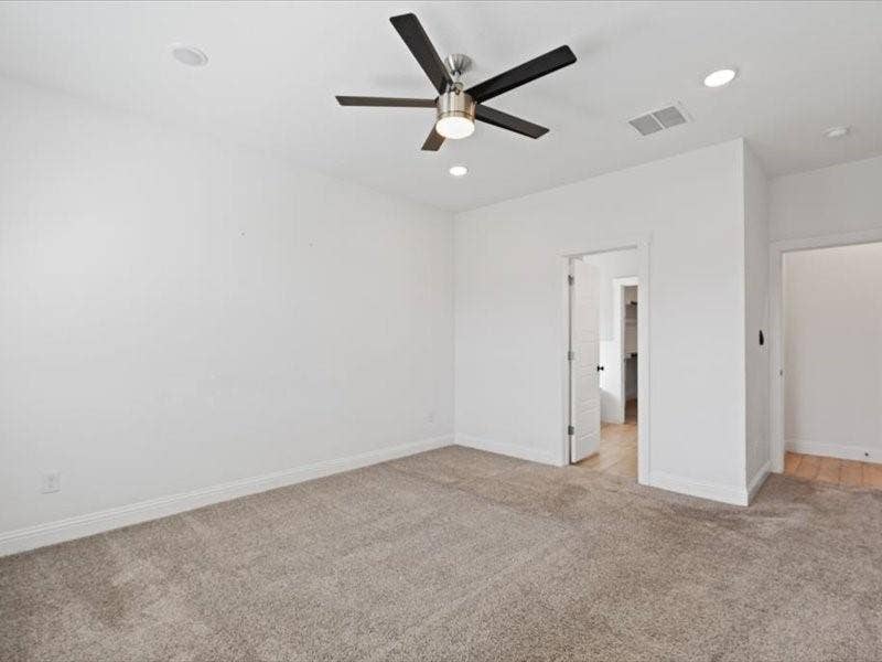 5528 Mesa Loop, Granbury, TX 76048 Room featuring neutral carpet flooring, white walls, and a contemporary ceiling fan with integrated lighting