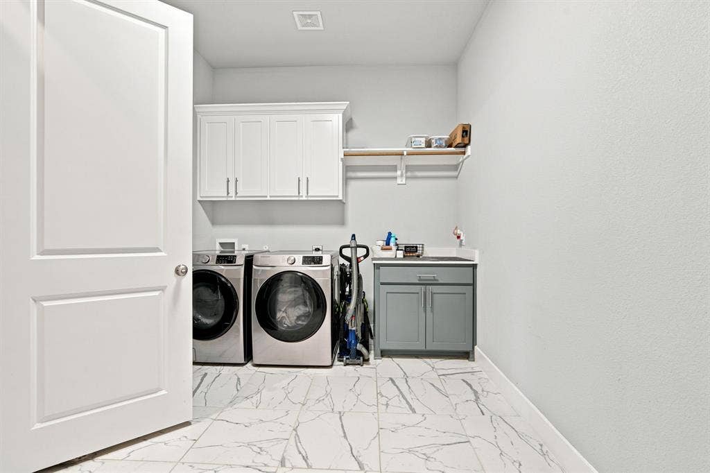 Laundry with access off primary suite