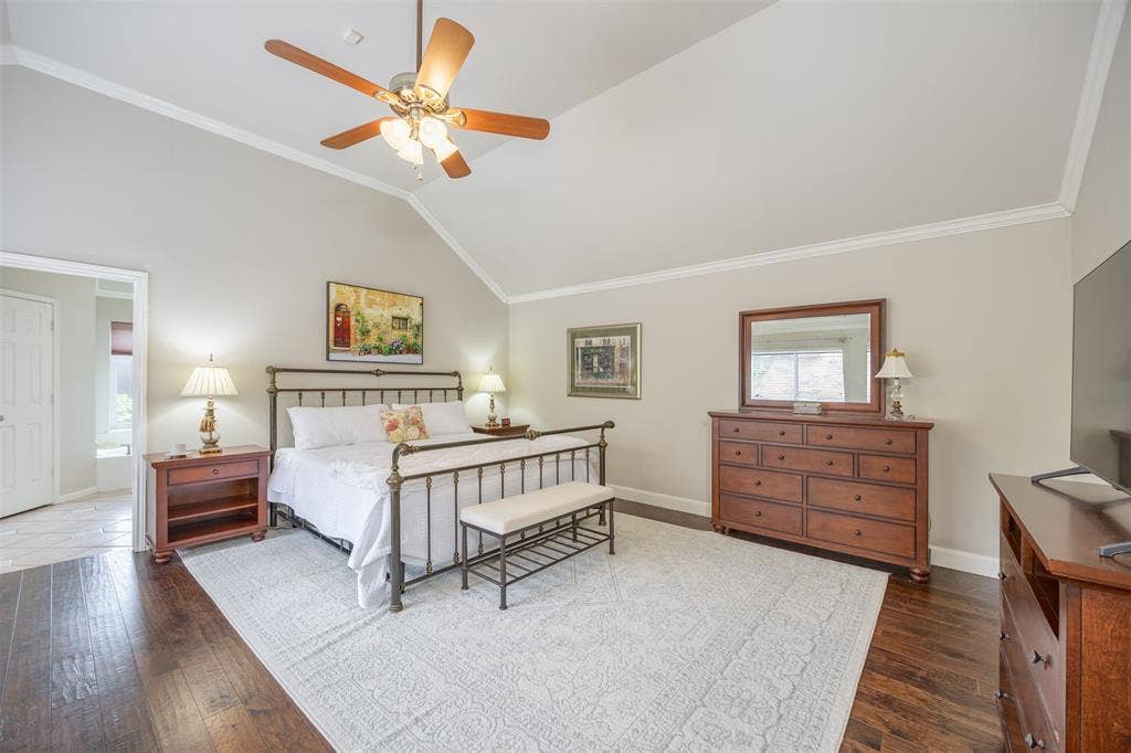 1717 Whitney Drive, Richardson, TX 75082 Vaulted ceiling with a ceiling fan and crown molding