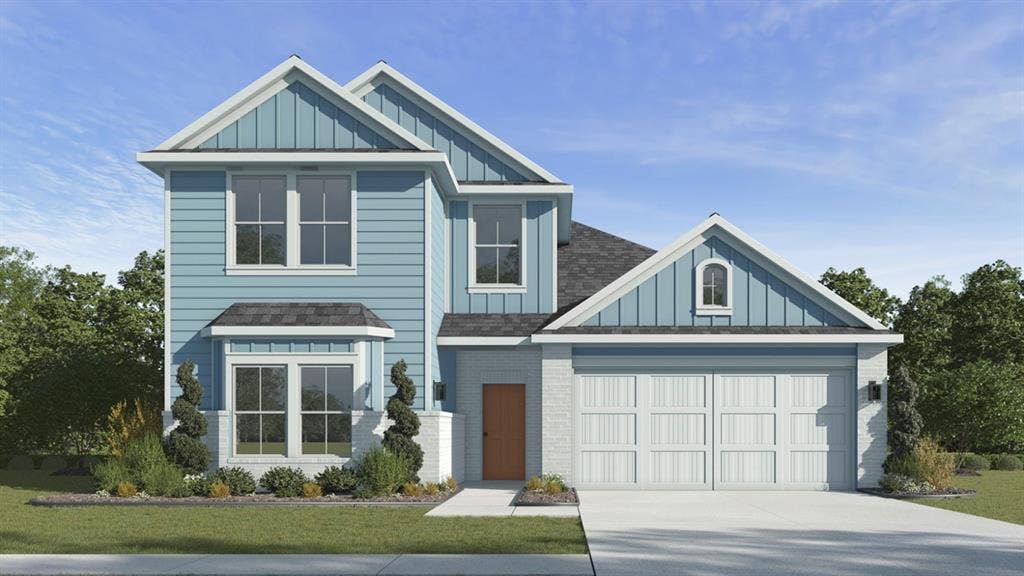 1933 Freeman Street, Tyler, TX 75704 Two-story residence featuring light blue siding, a two-car garage, and a bay window