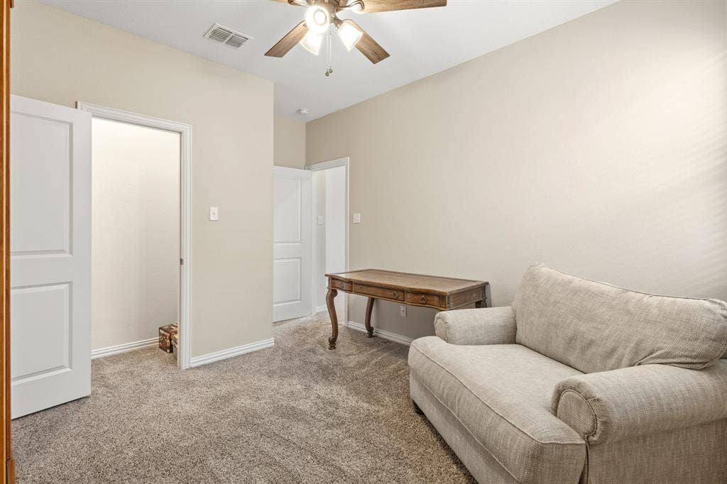 714 Stallings Drive, Princeton, TX 75407 Neutral-toned room featuring light beige walls and grey carpet