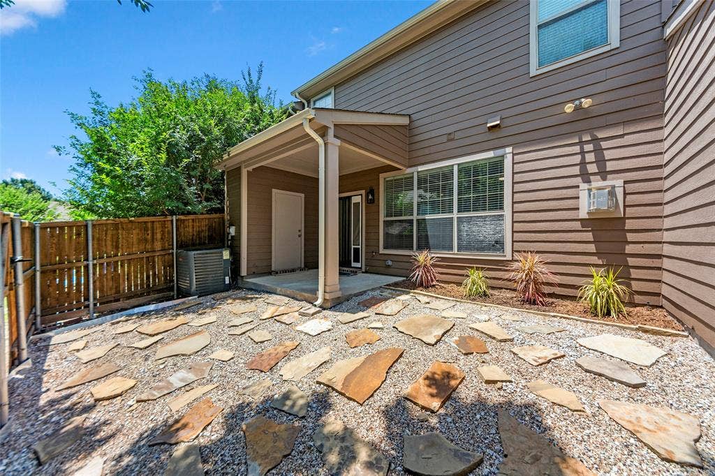 7916 Hannah Street, Plano, TX 75025 Private outdoor space featuring stone pavers and gravel landscaping, with a covered patio area